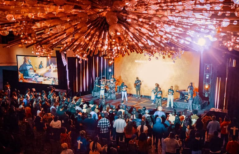 Students worshipping at an Impact Movement national conference